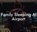 Family Sleeping At Airport