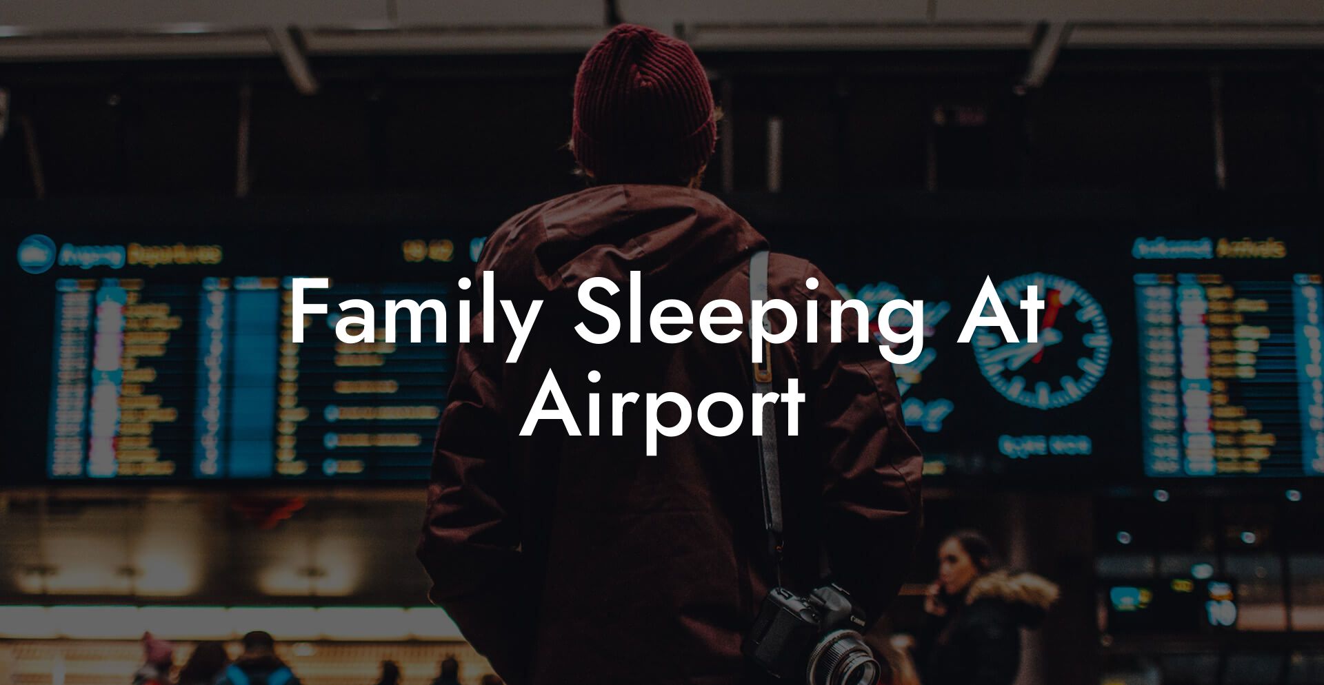 Family Sleeping At Airport